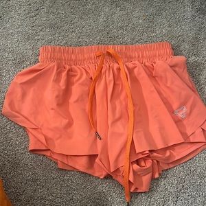 Loses flowy shorts with tight shorts built in under